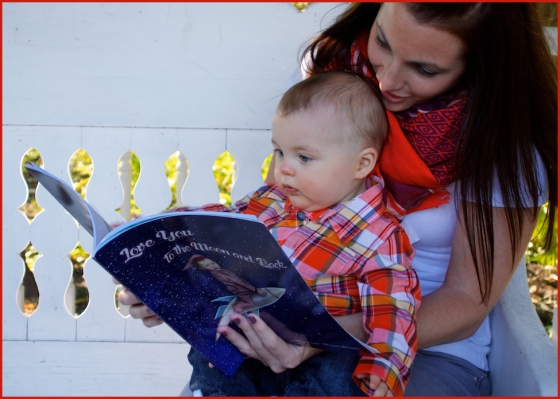 My daughter-in-law reading "Love you to the Moon and Back" to my grandson